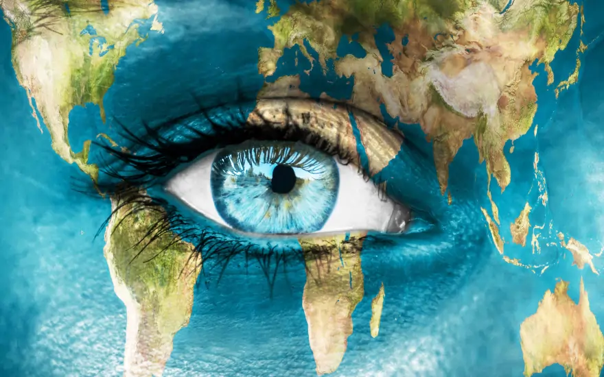 بهترین کشورها برای مهاجرت - a picture of world map with an eye